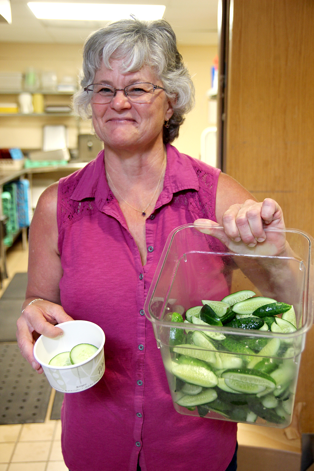 Deb from Nay Ah Shing school with the cucumbers