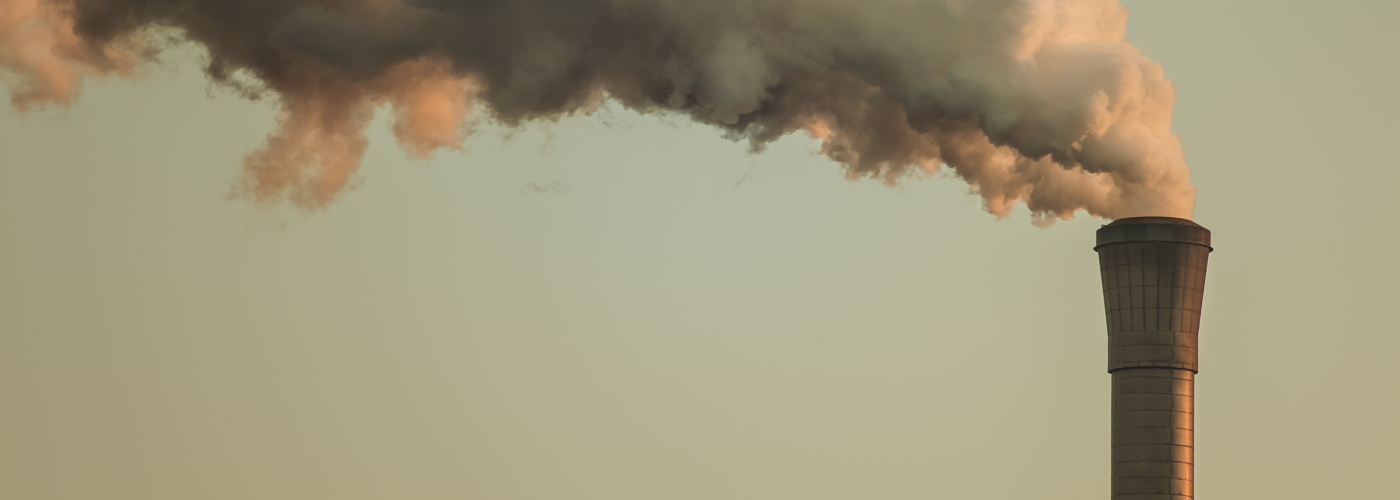 Smokestack with a foggy sky