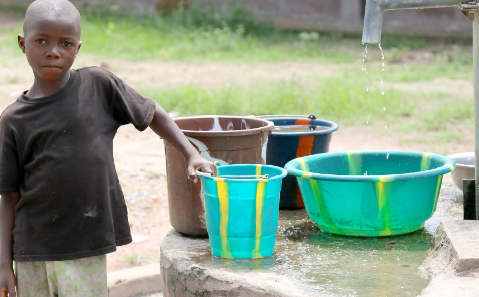 kid with water buckets