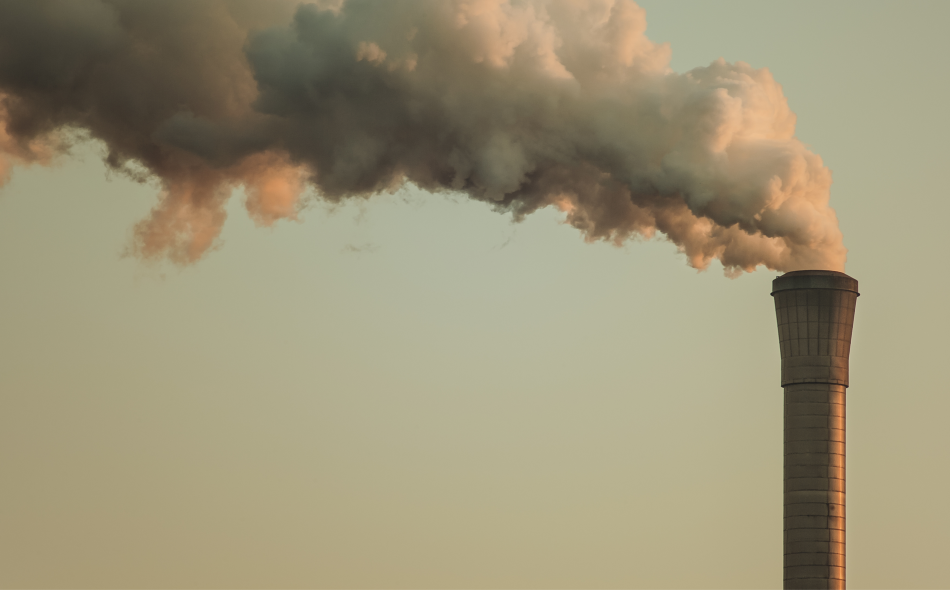 Smokestack with a foggy sky